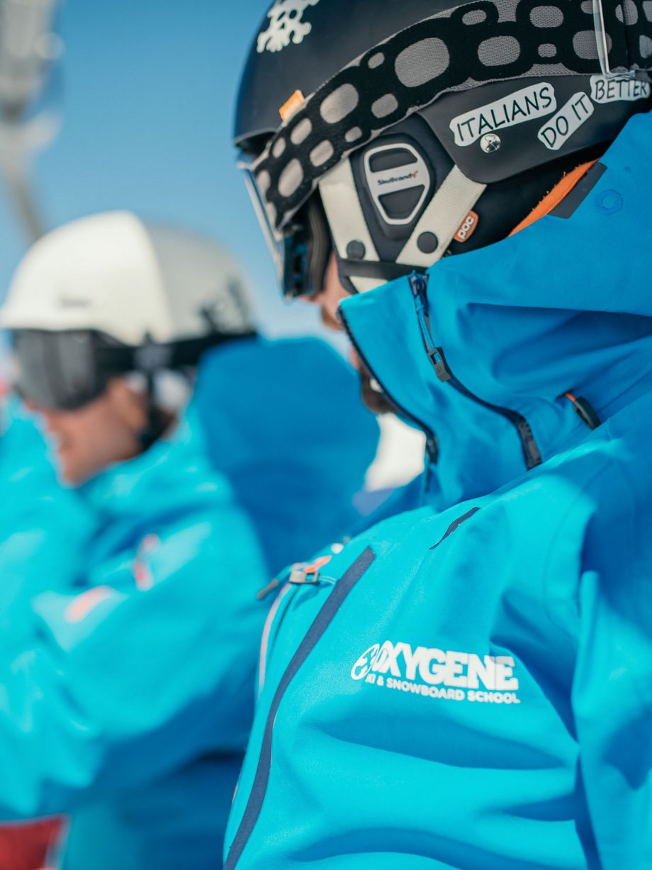 Oxygène Ski & Snowboard School Instructor in on Chair Lift