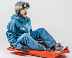 alternative to skiing vs snowboarding is sledging