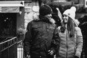 lovers under the snow walking in courchevel