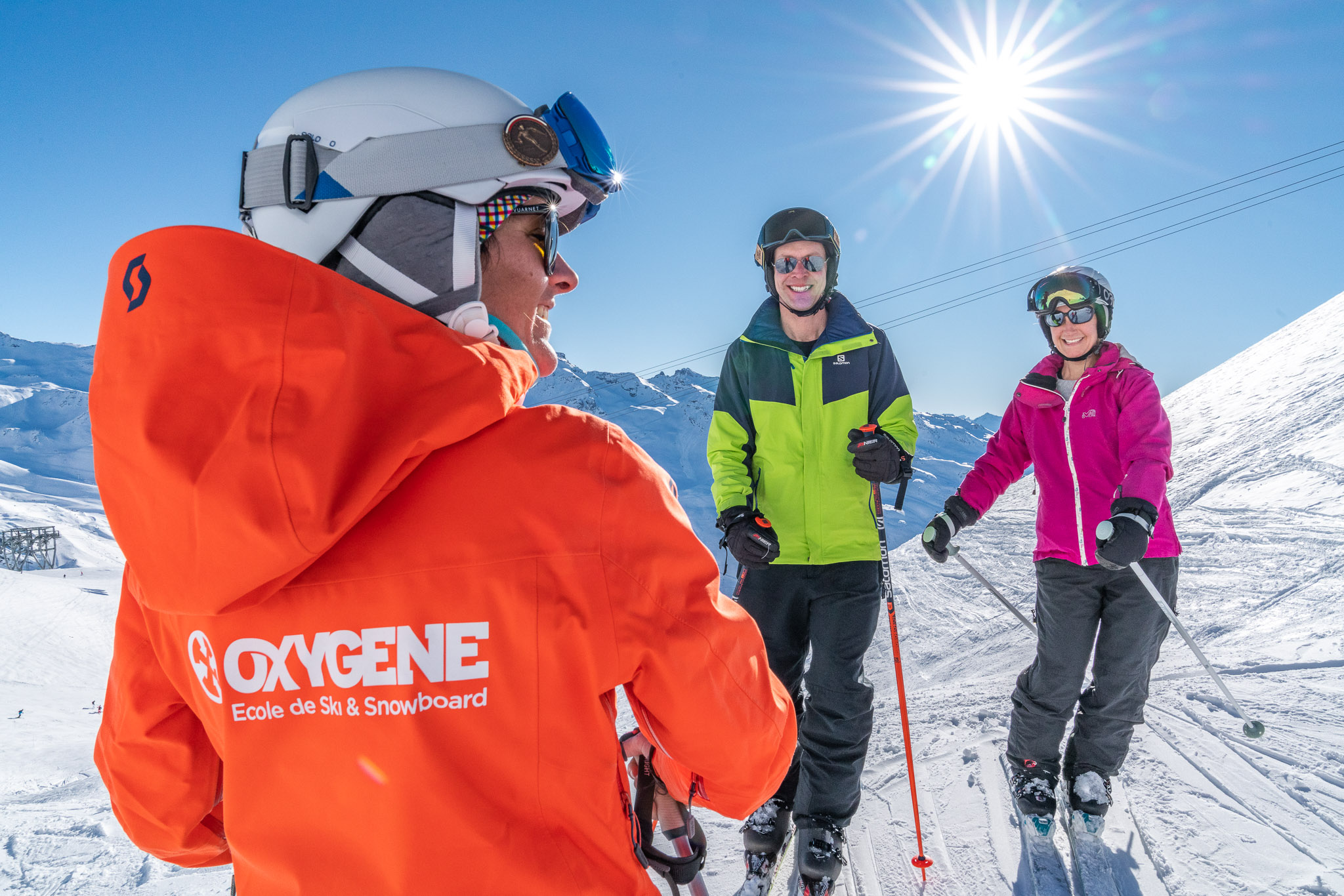 Oxygene ski instructors skiing with her students - 2019